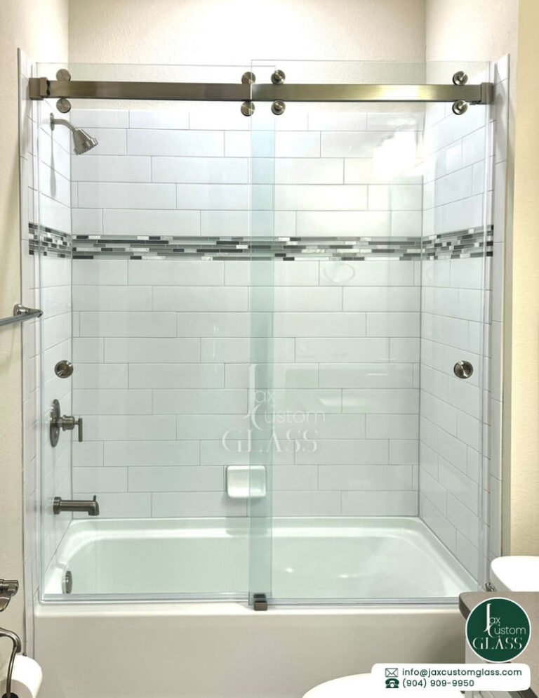 Bathtub double sliding glass doors with brushed nickel hardware