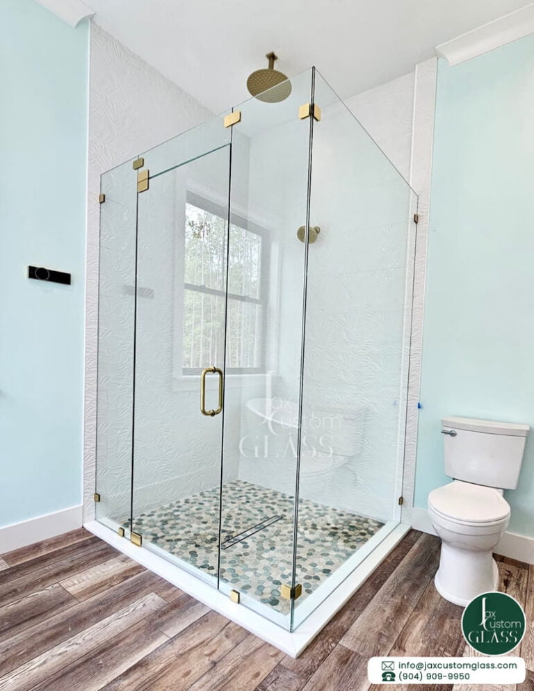 Ninety-Degree-Frameless-Shower-Enclosure-With-Brushed-Gold-Hardware