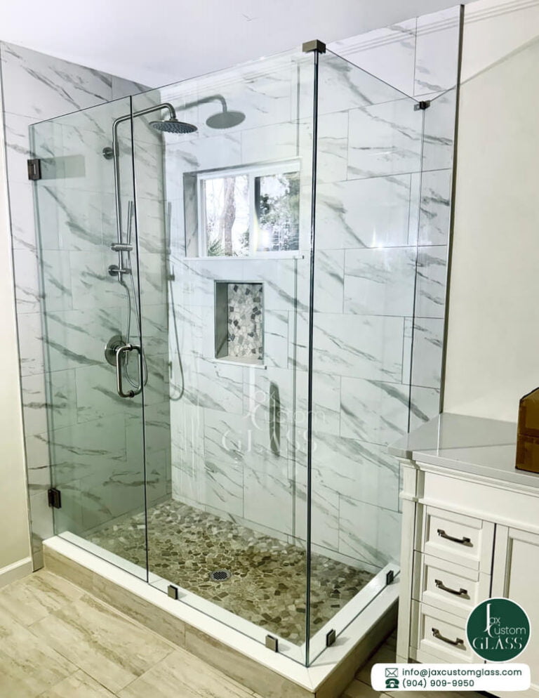 Ninety degree glass enclosure with swing door and brushed nickel hardware